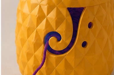Close-up of the pineapple texture and the carved yarn guide channel.