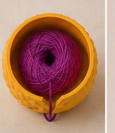 Top-down view into the bowl, showing the magenta yarn and center guide.